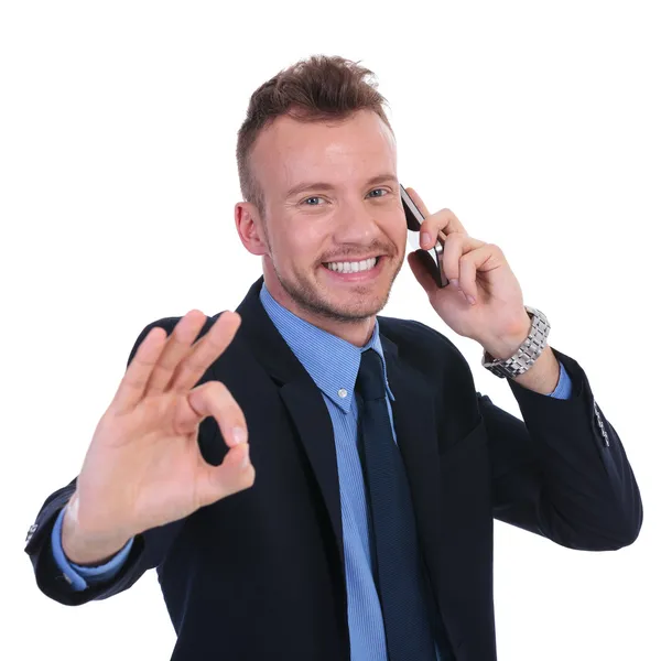 Business man on the phone shows ok Stock Image