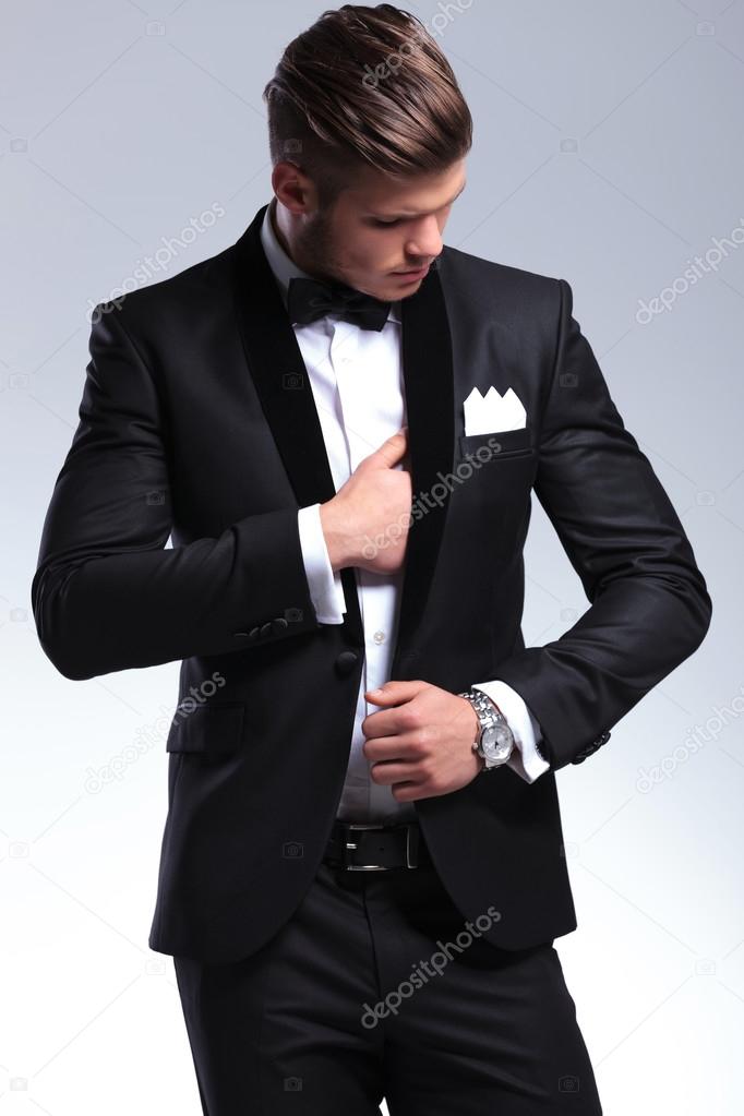 business man adjusting suit