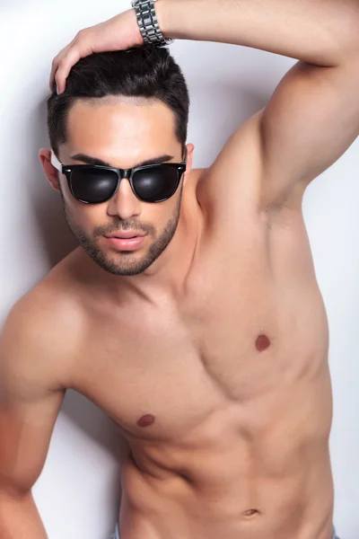 Topless young man fixing his hair — Stock Photo, Image