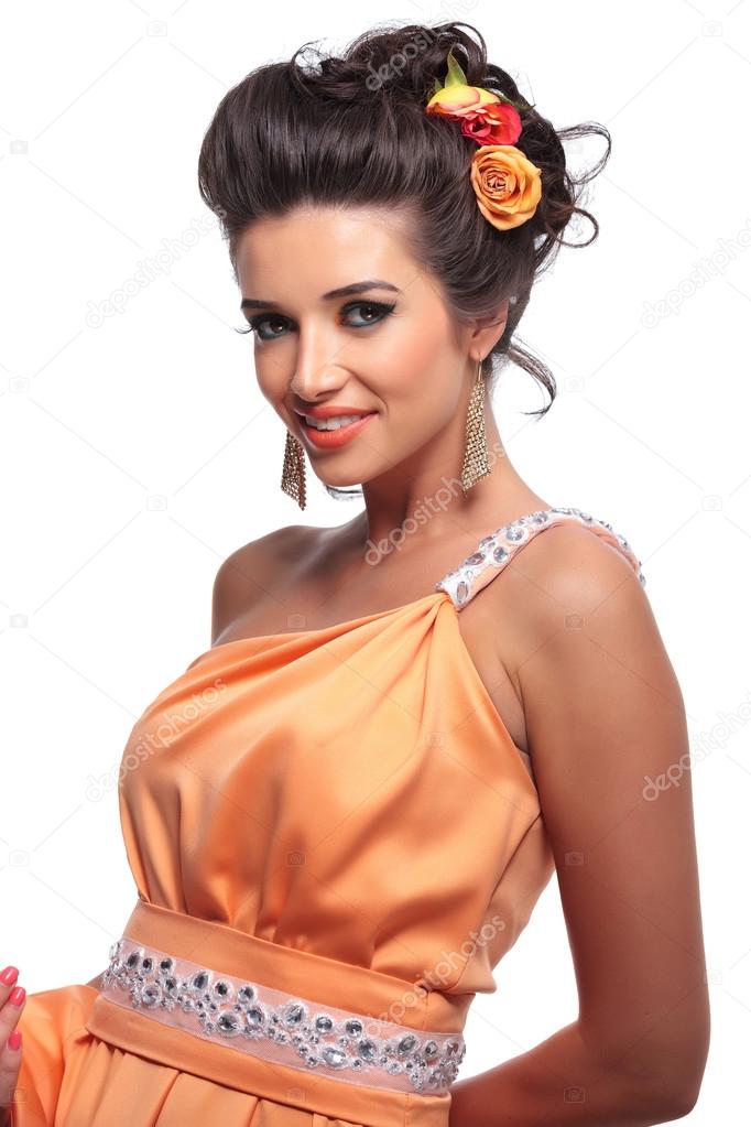 smiling beauty woman with nice makeup and flowers in her hair