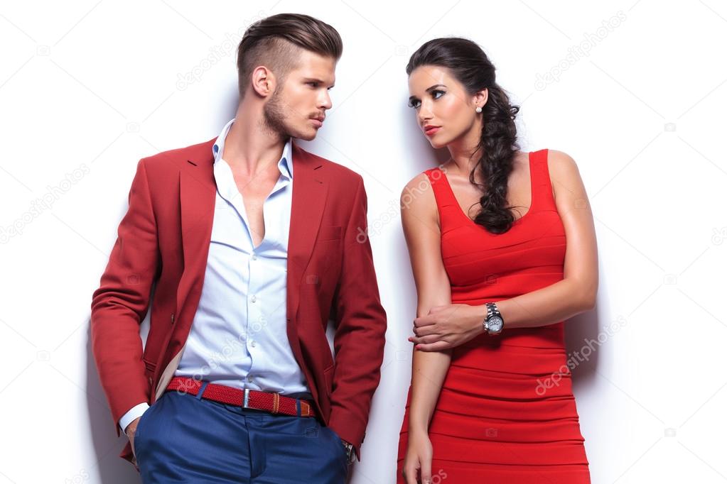 casual fashion man and woman looking at each other