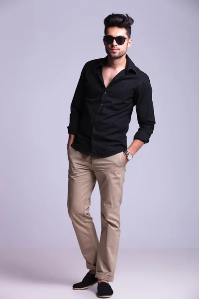 Young fashion man with both hands in pockets — Stock Photo, Image