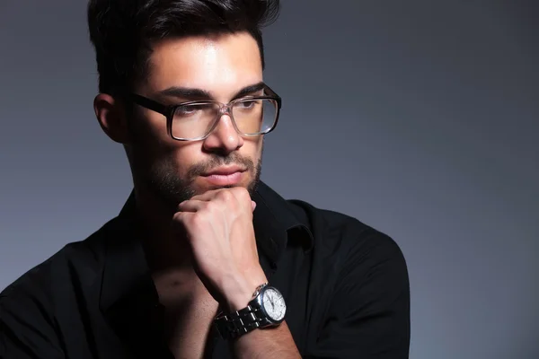 Young fashion man looking pensively away — Stock Photo, Image