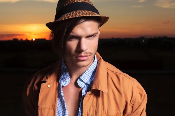 Casual man closeup with sunset behind — Stock Photo, Image