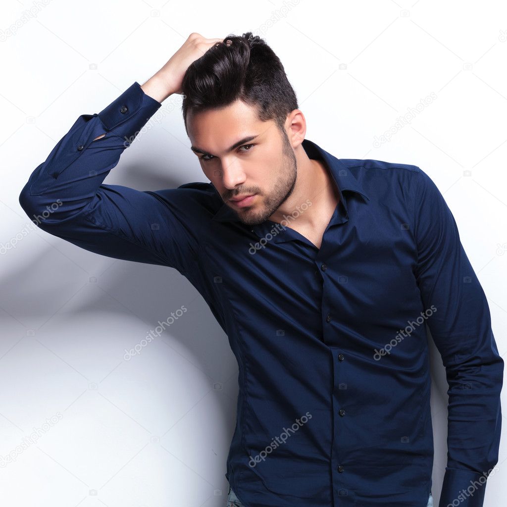 young man adjusting his hair