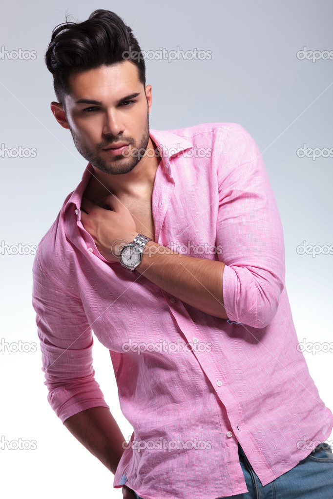 young fashion man with hand in shirt