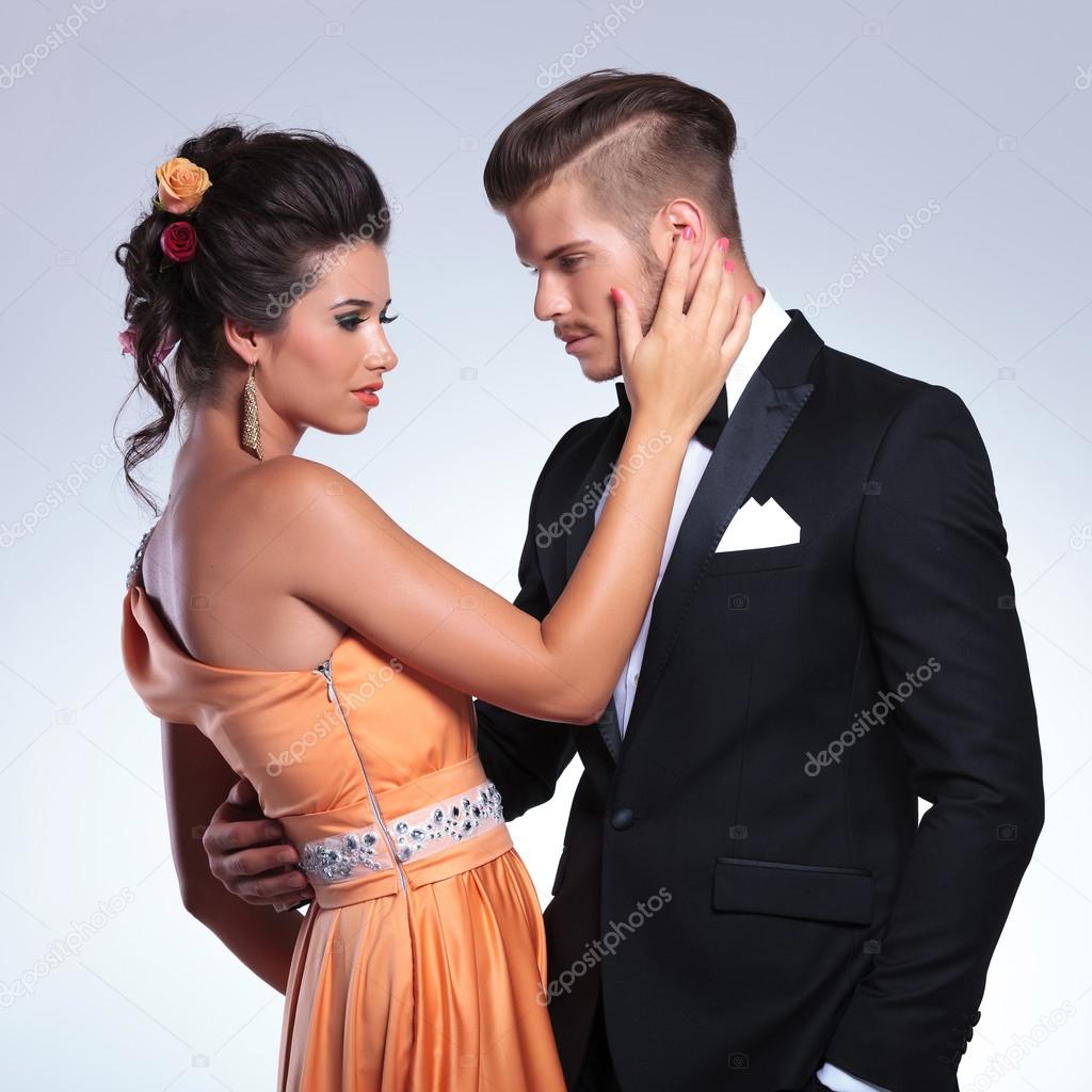 Fashion couple with woman touching man
