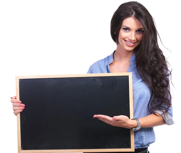 Casual woman holding a blackboard — Stock Photo, Image