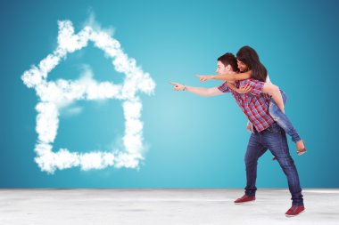 couple pointing to thier dream house made of clouds clipart