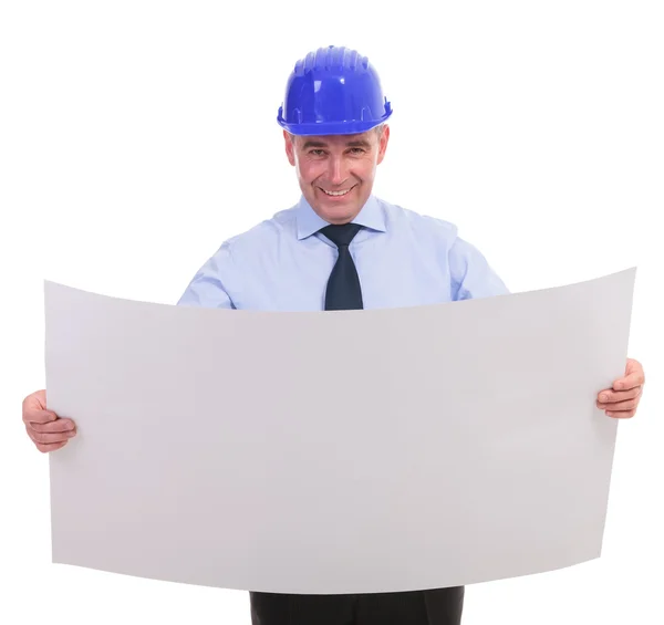 Senior engineer holding a spread project and smiling — Stock Photo, Image