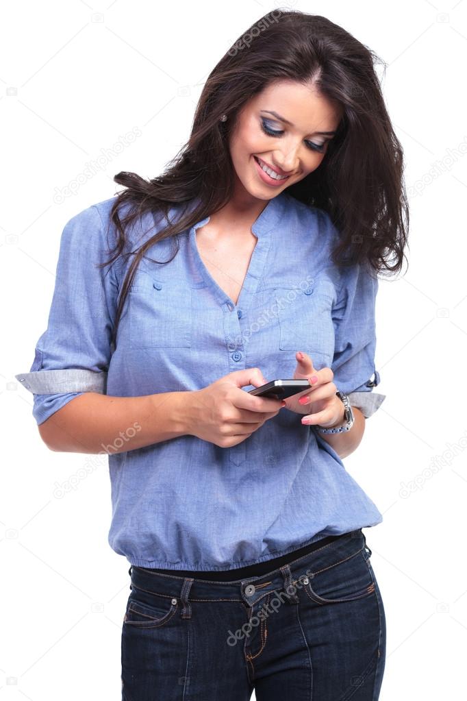 casual woman looks at her phone