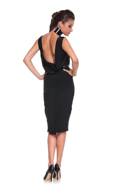 Woman in a black dress with naked back — Stock Photo, Image