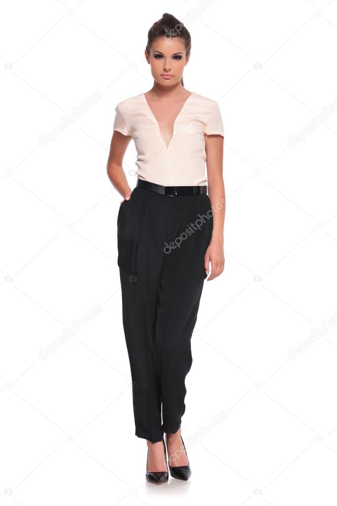 woman standing with hand in pocket