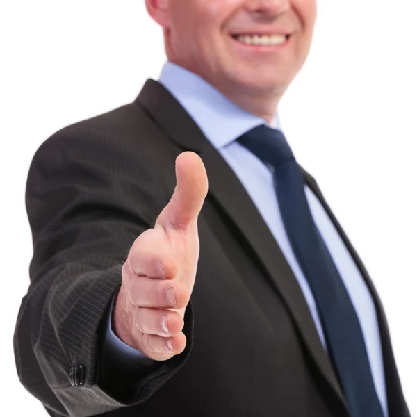 Business man offers hand for shaking — Stock Photo, Image