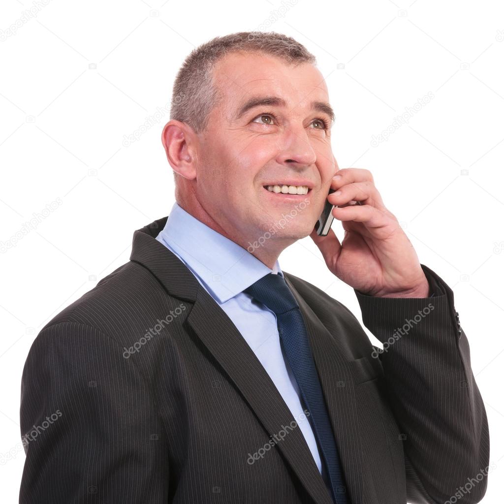 business man on the phone looks away