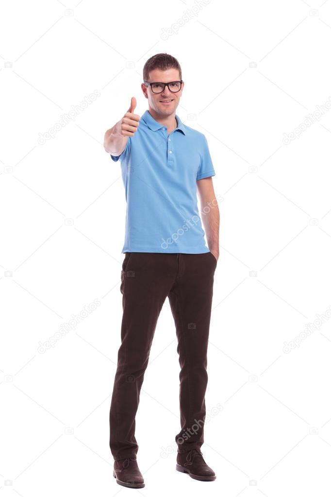 casual man with hand in pocket shows ok sign
