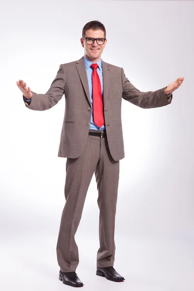 Young business man welcomes you — Stock Photo, Image