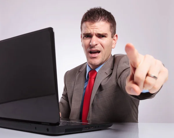 Young business man points at you from his laptop — Stock Photo, Image