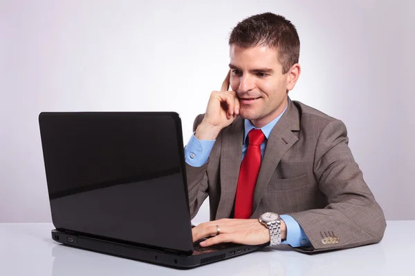 Young business man works on laptop Stock Photo