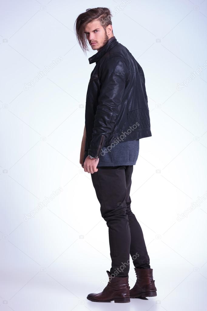 back view of a young fashion man in leather jacket