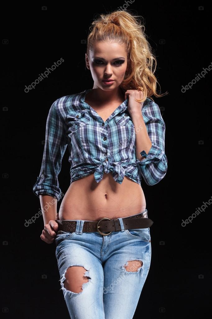 avea slănină în mod constant  Fashion sexy woman in jeans and shirt holding her collar Stock Photo by  ©feedough 34757651
