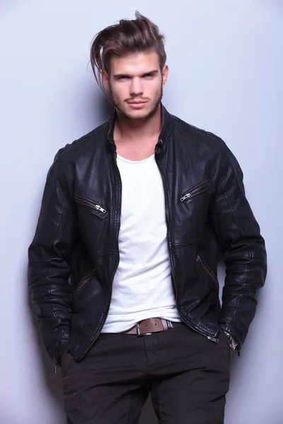 Young man with a black leather jacket smiling — Stock Photo, Image