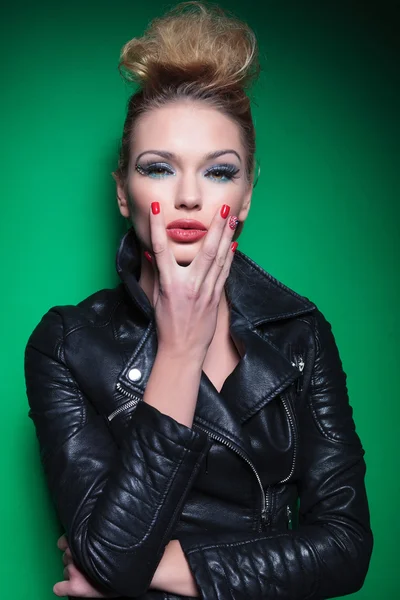 Portrait of a young sexy woman holding her chin — Stock Photo, Image