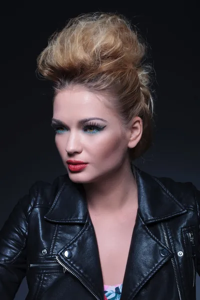 Side view of a young beauty woman in leather jacket — Stock Photo, Image