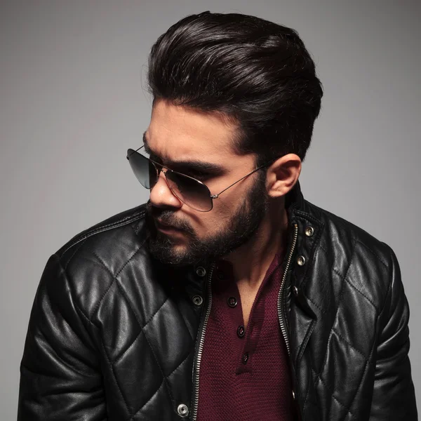 Profile of a young man in sunglasses and leather jacket — Stock Photo, Image
