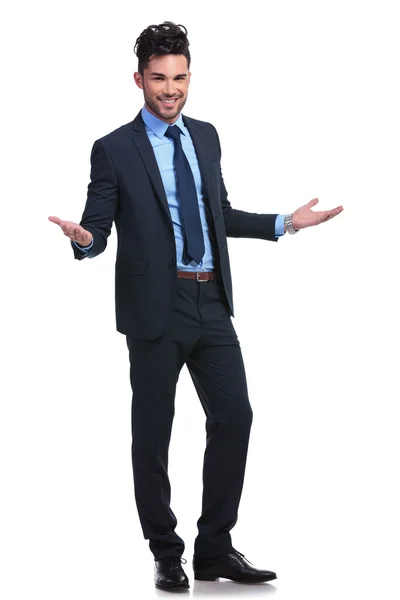 Full body picture of a young business man welcoming — Stock Photo, Image