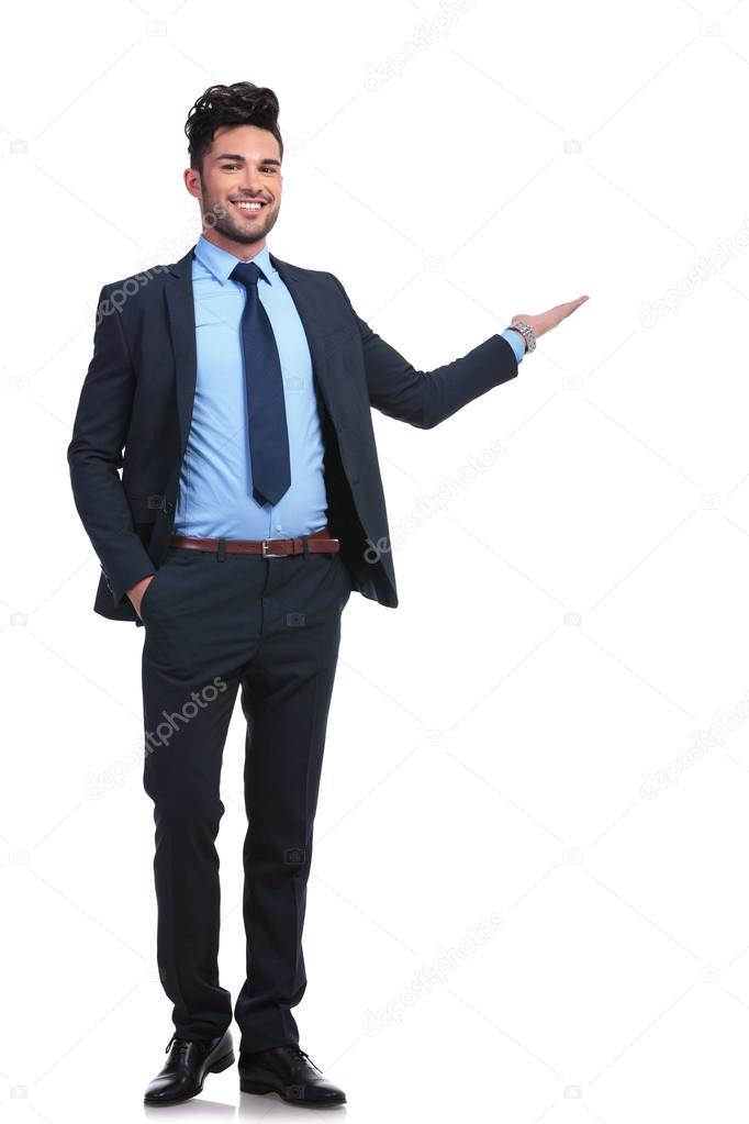 full body picture of a happy business man presenting