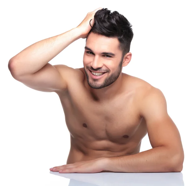 Young laughing man is posing for the camera — Stock Photo, Image