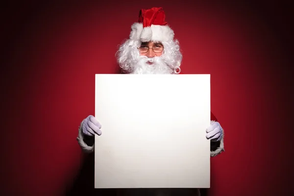 Santa claus visar du ett tomt tecken — Stockfoto