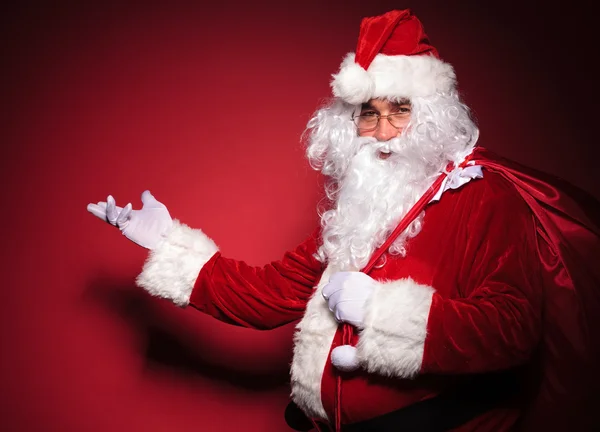 Side view of santa claus presenting — Stock Photo, Image