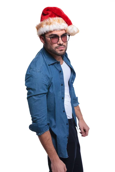 Side view of an angry man in santa claus hat — Stock Photo, Image