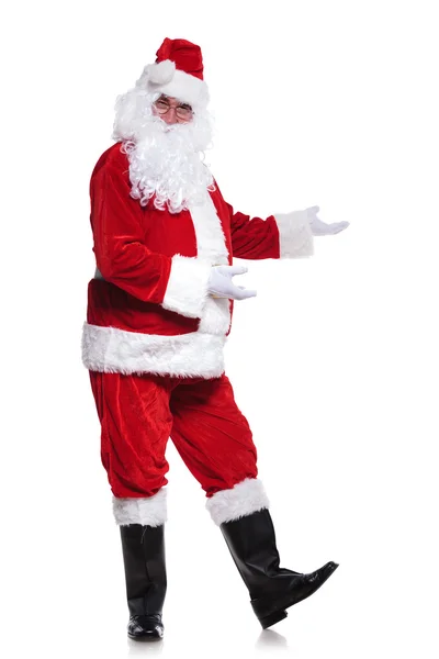 Full body picture of santa claus presenting — Stock Photo, Image