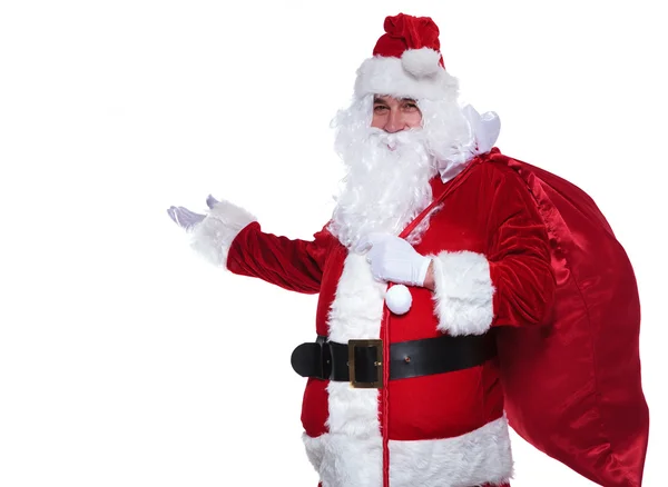 Weihnachtsmann präsentiert etwas — Stockfoto