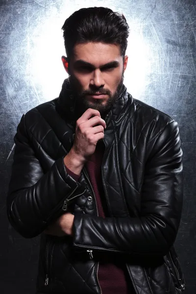 Pensive fashion young man in leather jacket — Stock Photo, Image