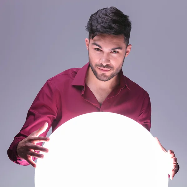 Stock image casual man acting as a fortune teller