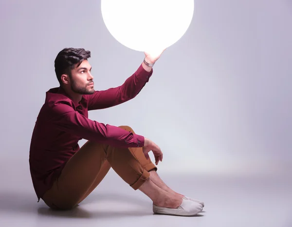 Man reaching out for the light of his future — Stock Photo, Image