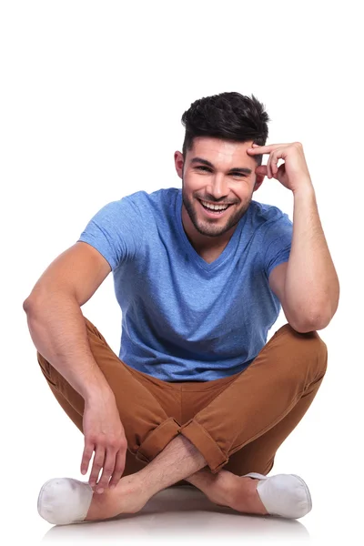 Young pensive casual man sitting relaxed — Stock Photo, Image