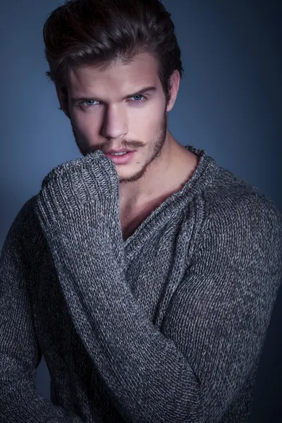 Portrait of a sexy man in warm sweater — Stock Photo, Image