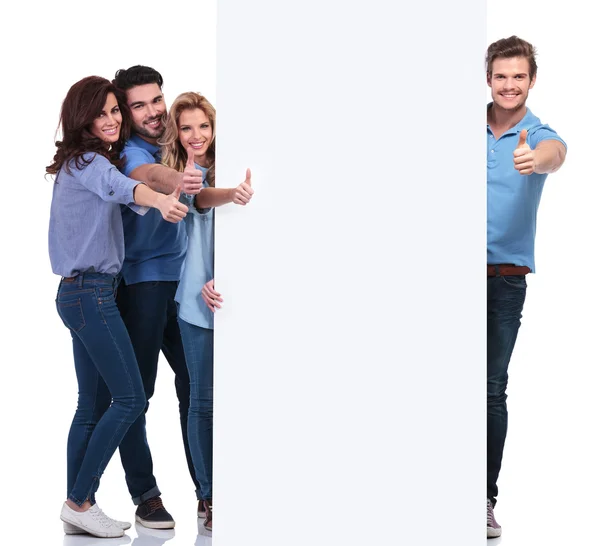 Group of people making the ok sign while presenting board — Stock Photo, Image