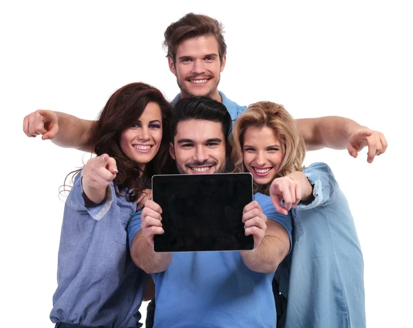 Group of people showing screen of tablet and point fingers — Stock Photo, Image