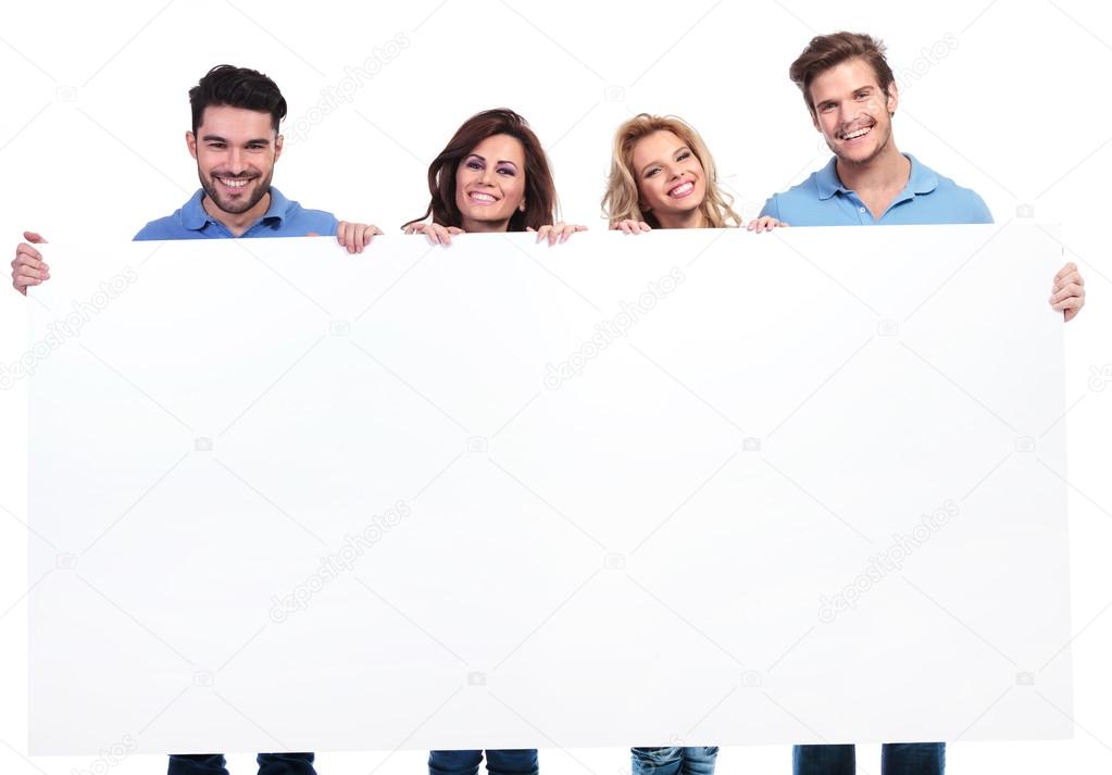 casual young people showing a big blank banner and smile