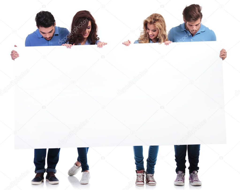 casual people holding and looking at a blank board