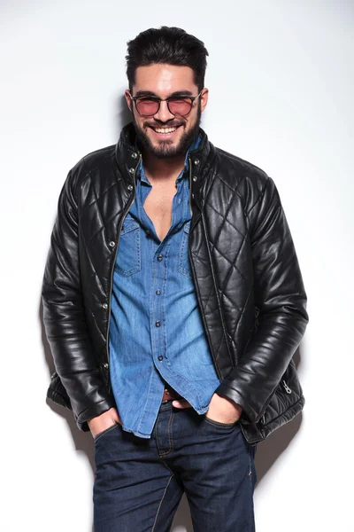 Man in leather jacket smiling to the camera — Stock Photo, Image