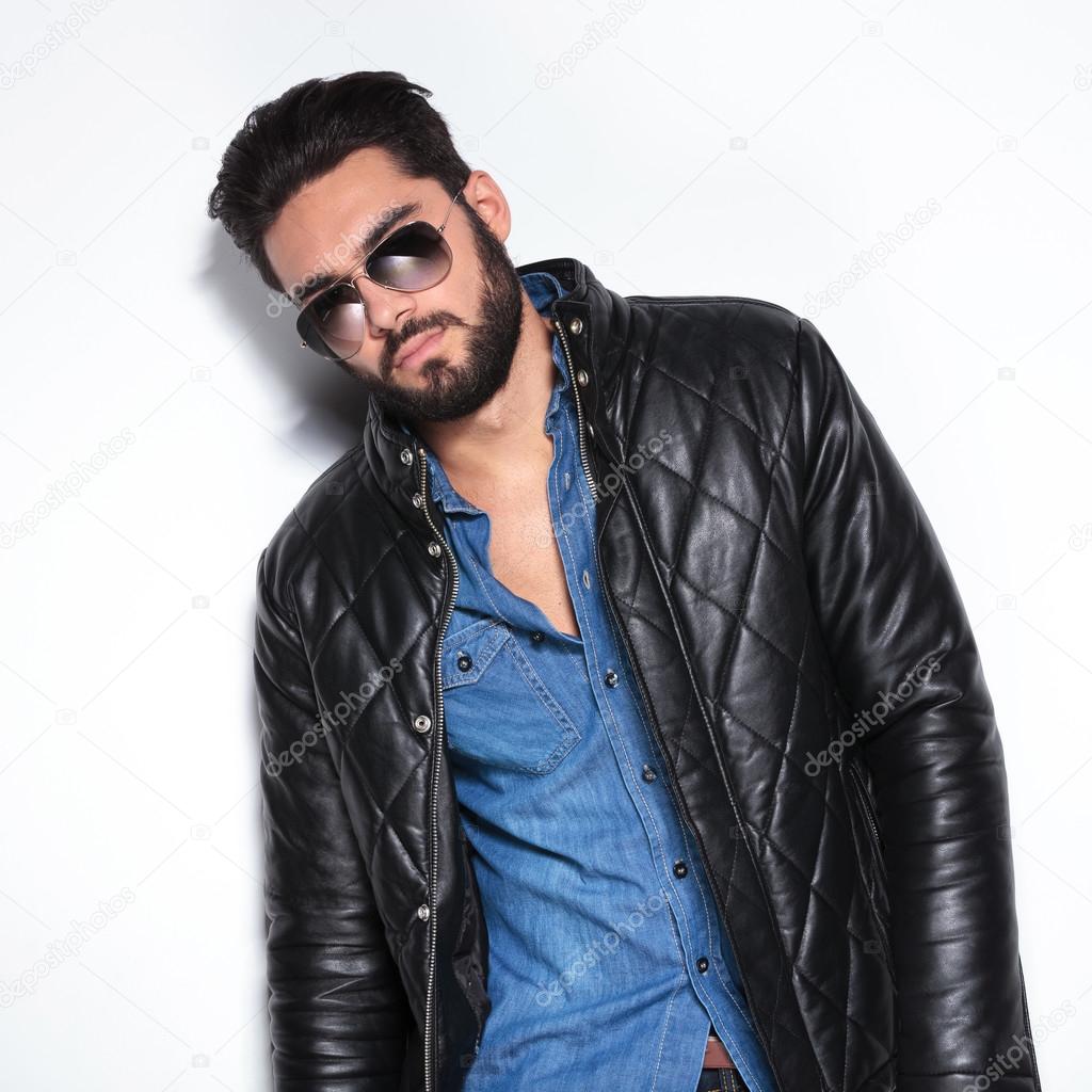 model in leather jacket and sunglasses posing
