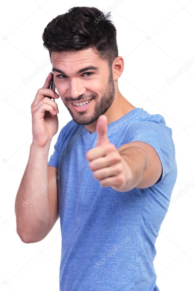 Casual man with good news on the phone