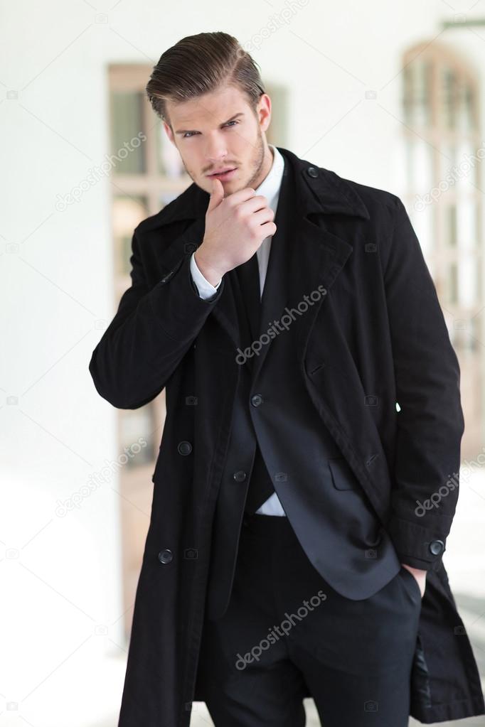 young business man touches his lip
